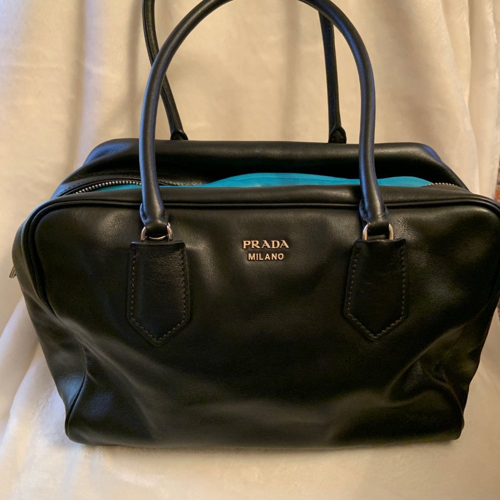 Prada Inside Bag Black exterior with turquoise interior